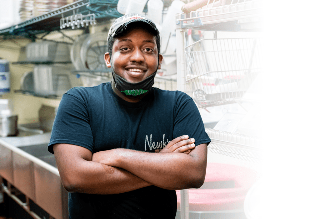 Man standing in a kitchen for National Disability Employment Awareness Month (NDEAM)