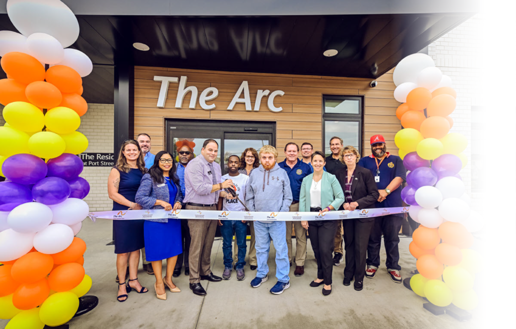 Group of people cutting the ribbon at Port Street Commons